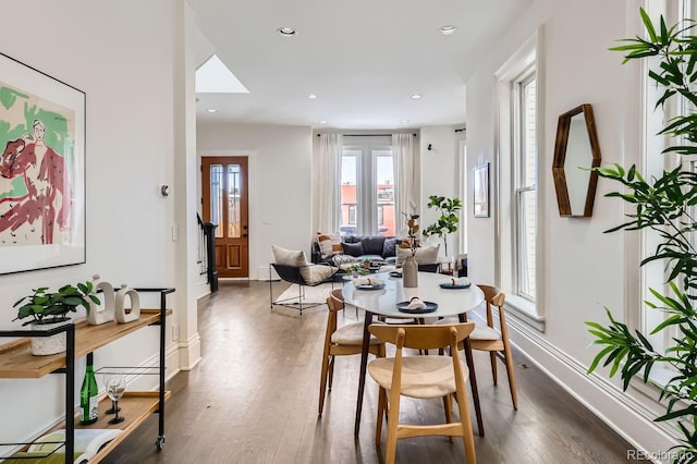 dining room with dark wood-type flooring