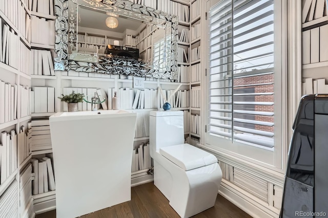 bathroom with hardwood / wood-style floors