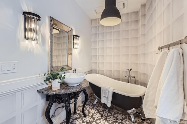 bathroom with a bathing tub and sink