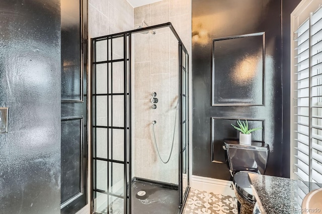 bathroom with a shower with shower door