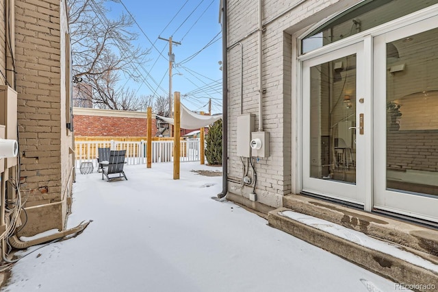 view of snow covered patio