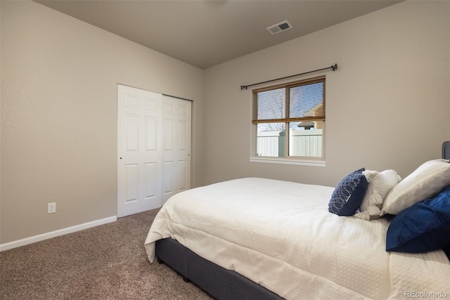 carpeted bedroom featuring a closet