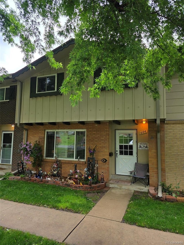604 S Xenon Ct, Lakewood, CO 80228 - townhome / multi-family property featuring brick siding and board and batten siding