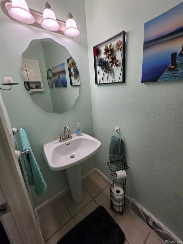 604 S Xenon Ct, Lakewood, CO 80228 - bathroom with tile patterned floors and baseboards