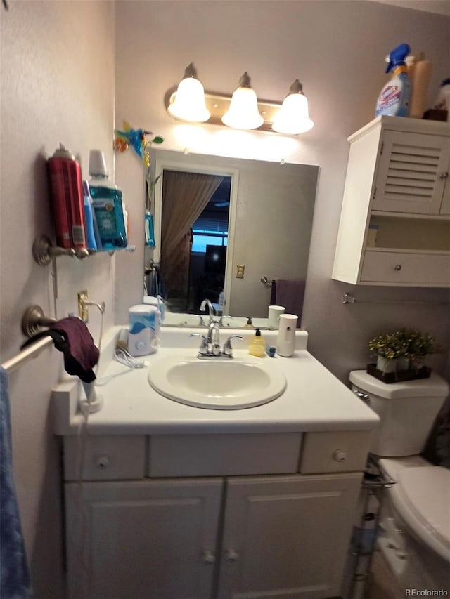 604 S Xenon Ct, Lakewood, CO 80228 - half bathroom featuring vanity and toilet