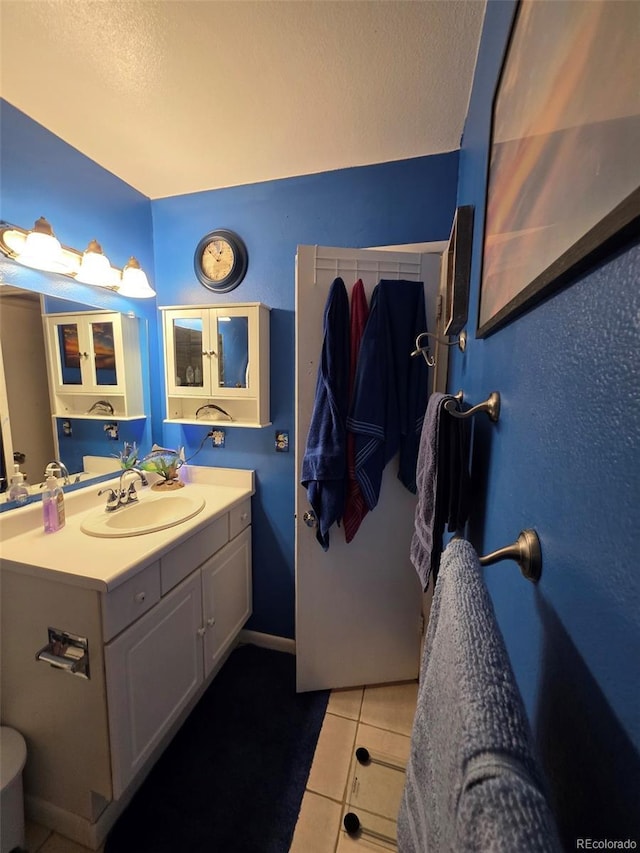 604 S Xenon Ct, Lakewood, CO 80228 - bathroom with tile patterned flooring and vanity