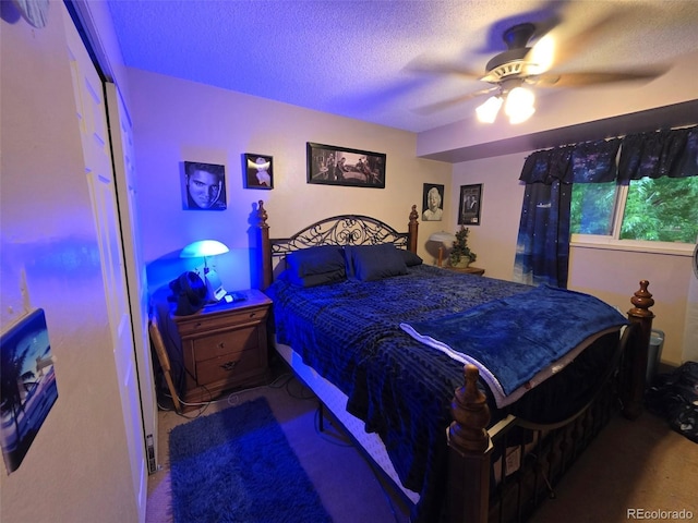 604 S Xenon Ct, Lakewood, CO 80228 - bedroom with a textured ceiling, carpet flooring, and ceiling fan
