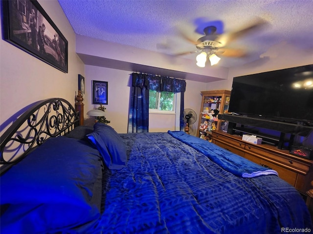 604 S Xenon Ct, Lakewood, CO 80228 - bedroom featuring a textured ceiling and ceiling fan