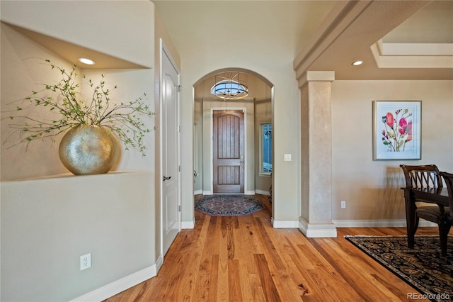 12477 Creekhurst Dr, Colorado Springs, CO 80921 - entryway featuring light wood finished floors, arched walkways, recessed lighting, and baseboards