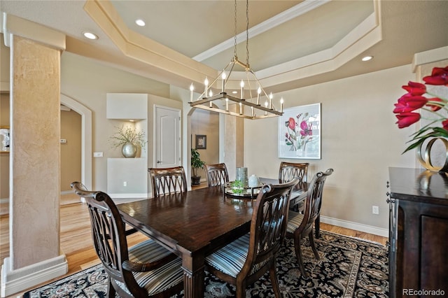 12477 Creekhurst Dr, Colorado Springs, CO 80921 - dining space featuring light wood-style floors, baseboards, a chandelier, recessed lighting, and arched walkways
