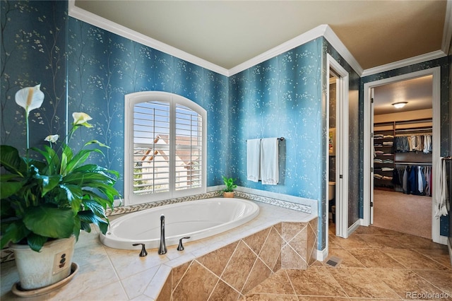 12477 Creekhurst Dr, Colorado Springs, CO 80921 - bathroom with crown molding, a walk in closet, a bath, baseboards, and wallpapered walls