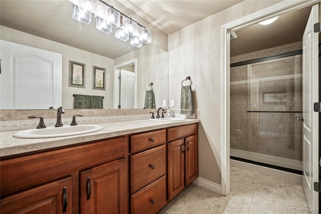 12477 Creekhurst Dr, Colorado Springs, CO 80921 - bathroom with a shower stall, double vanity, and baseboards