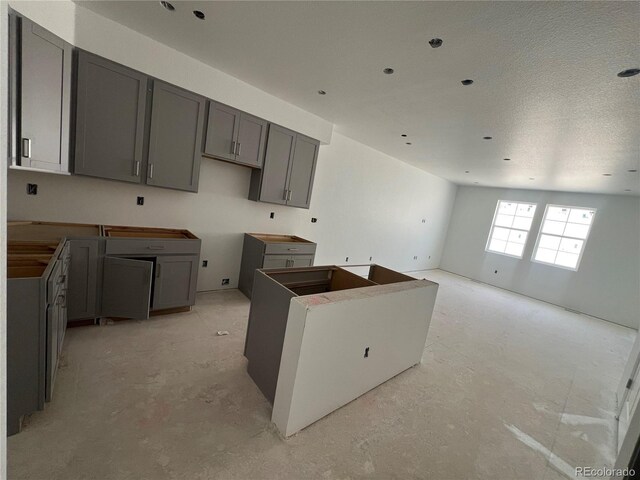 kitchen with gray cabinetry and a center island