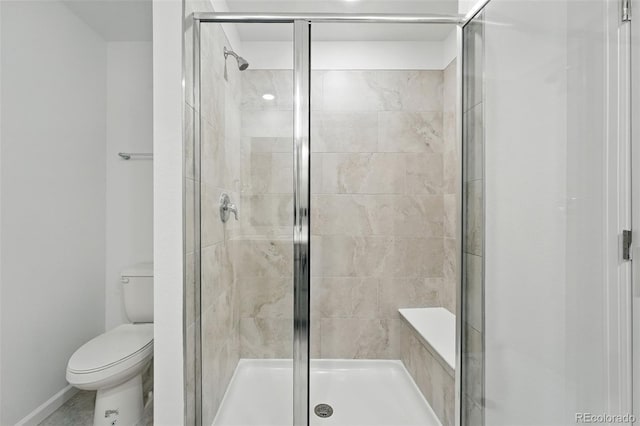 17115 W 91st Ln, Arvada, CO 80007 - bathroom with a shower stall, toilet, and baseboards