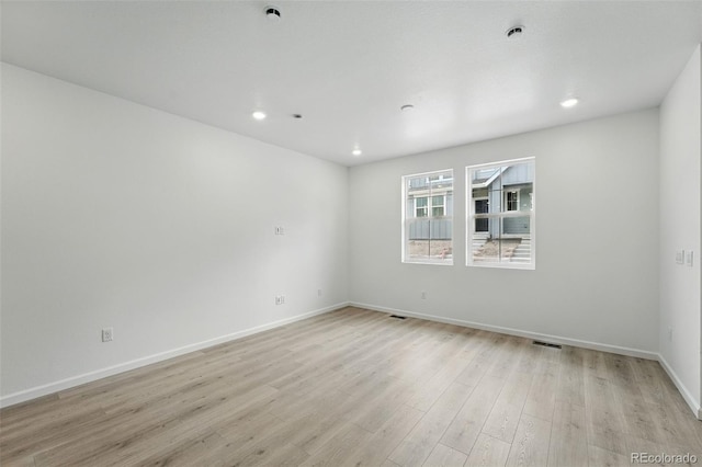17115 W 91st Ln, Arvada, CO 80007 - spare room featuring light wood-type flooring, baseboards, recessed lighting, and a pendent fire sprinkler