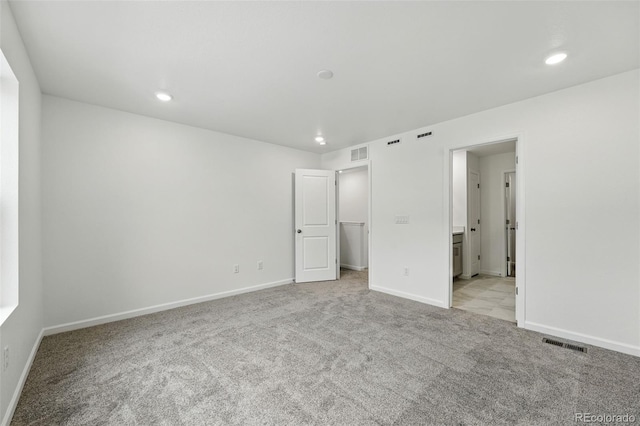 17115 W 91st Ln, Arvada, CO 80007 - unfurnished bedroom with carpet floors, baseboards, recessed lighting, and a spacious closet