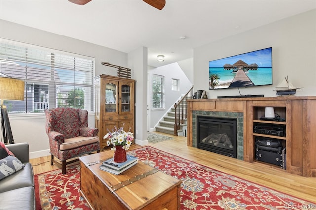 3240 Spruce St, Denver, CO 80238 - living area with a ceiling fan, light wood-type flooring, plenty of natural light, and stairs