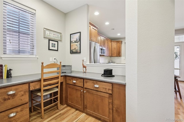 3240 Spruce St, Denver, CO 80238 - office featuring built in desk, light wood-style floors, healthy amount of natural light, and recessed lighting