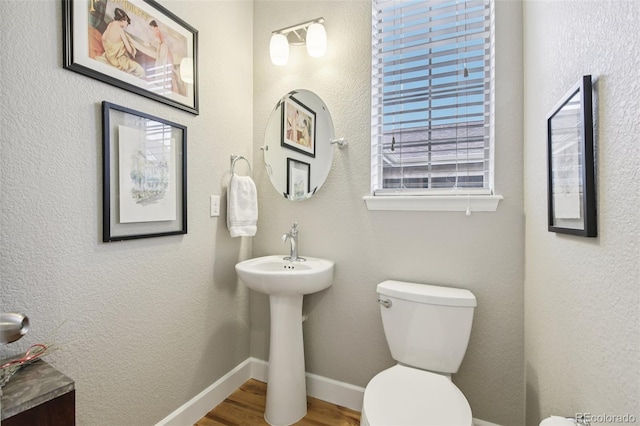3240 Spruce St, Denver, CO 80238 - bathroom featuring toilet and wood finished floors