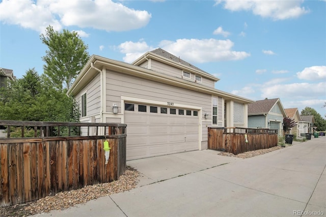 3240 Spruce St, Denver, CO 80238 - traditional-style house featuring concrete driveway and an attached garage