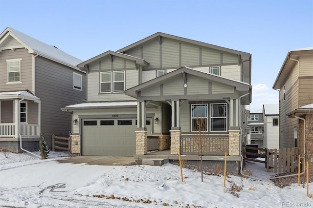 view of front of home with a porch and a garage