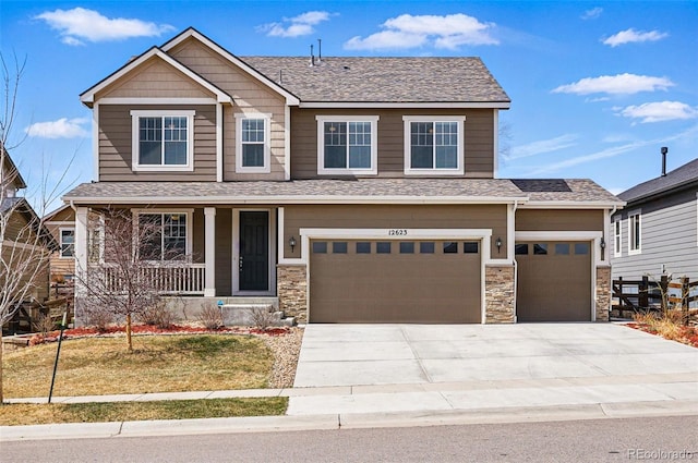 12623 Canoe St, Firestone, CO 80504 - craftsman-style home featuring covered porch, driveway, stone siding, a garage, and roof with shingles