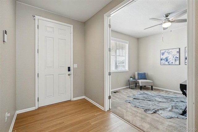 12623 Canoe St, Firestone, CO 80504 - entrance foyer with light wood-style floors and ceiling fan