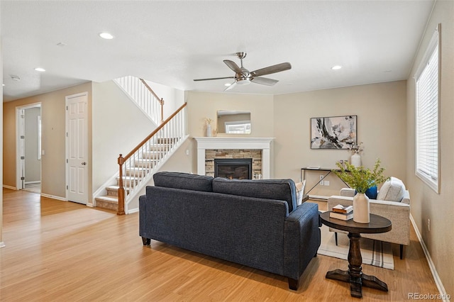 12623 Canoe St, Firestone, CO 80504 - living room with light wood-style flooring, stairs, ceiling fan, plenty of natural light, and recessed lighting