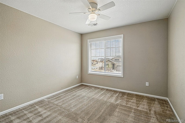 12623 Canoe St, Firestone, CO 80504 - empty room featuring a ceiling fan, carpet flooring, a textured wall, and a textured ceiling