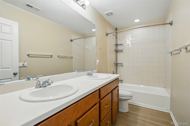12623 Canoe St, Firestone, CO 80504 - bathroom featuring shower / bath combination, double vanity, and wood finished floors