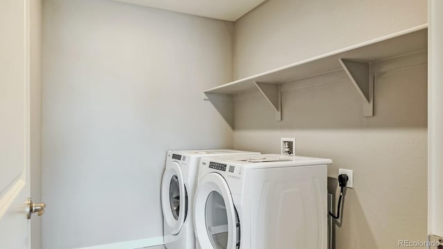 laundry room with independent washer and dryer