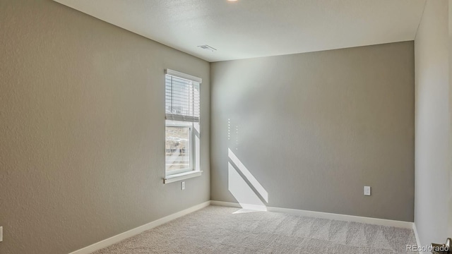 empty room with carpet flooring