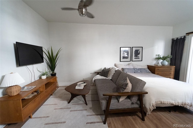 bedroom featuring wood finished floors and a ceiling fan
