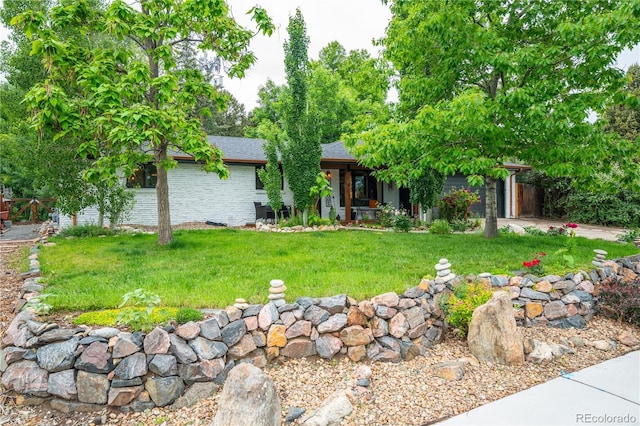 3125 Xenon St, Wheat Ridge, CO 80215 - view of front of property with a front lawn and a garage