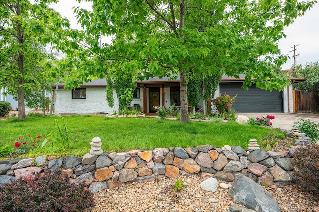 3125 Xenon St, Wheat Ridge, CO 80215 - ranch-style house featuring a front lawn, brick siding, and driveway