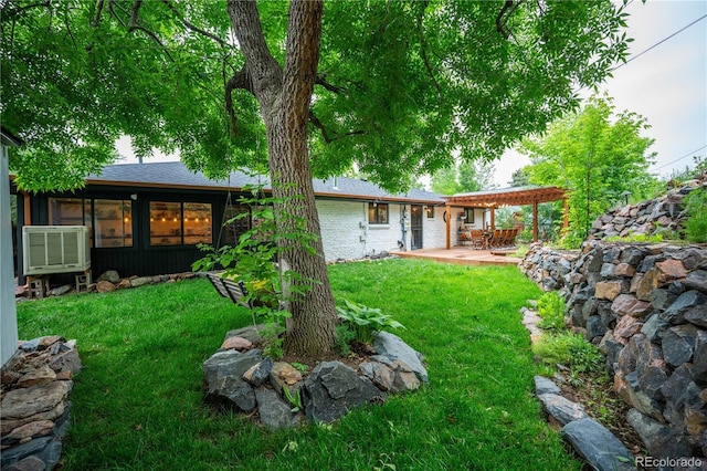3125 Xenon St, Wheat Ridge, CO 80215 - view of grassy yard featuring a patio area and a pergola
