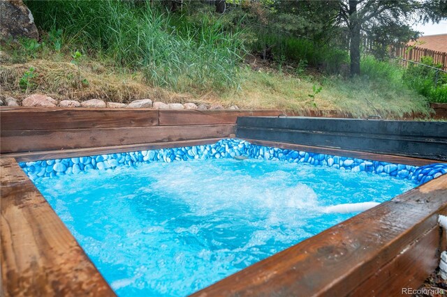 3125 Xenon St, Wheat Ridge, CO 80215 - view of swimming pool featuring a jacuzzi and a pool