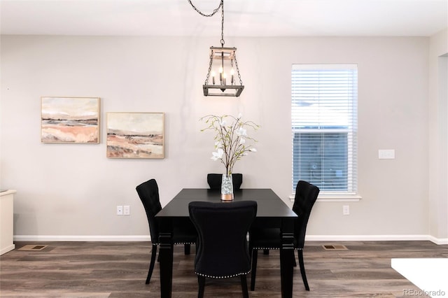 dining room with dark hardwood / wood-style flooring