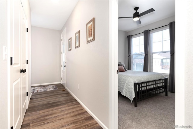 bedroom with ceiling fan and dark hardwood / wood-style flooring