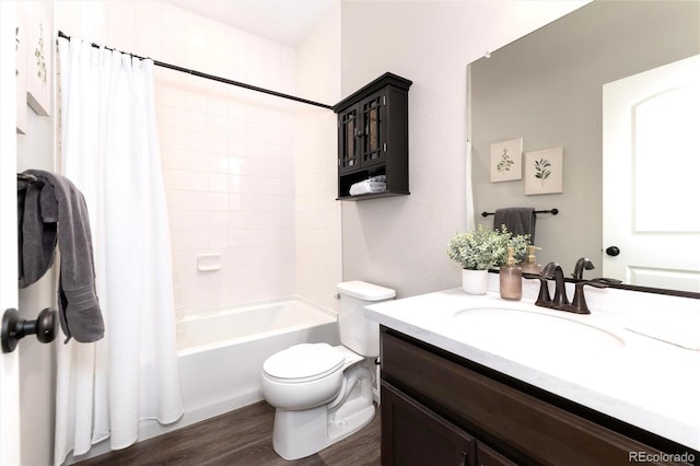 full bathroom featuring toilet, hardwood / wood-style flooring, vanity, and shower / tub combo with curtain