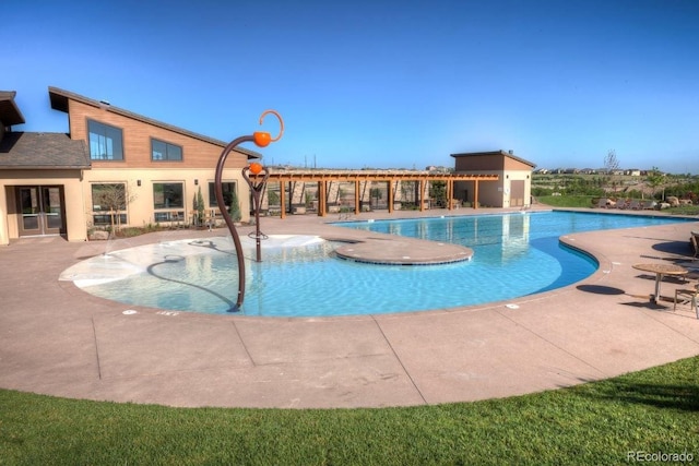 view of swimming pool with a patio area