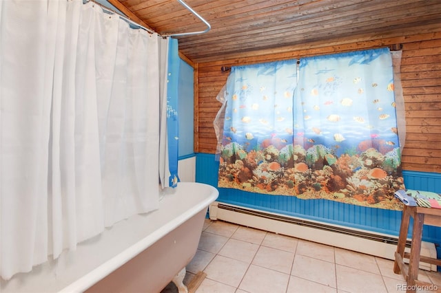 bathroom with tile patterned flooring, wooden ceiling, wooden walls, and a baseboard radiator