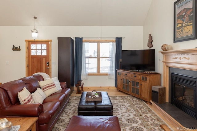 living room with wood-type flooring and vaulted ceiling