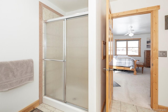 bathroom featuring tile patterned flooring, ceiling fan, and walk in shower