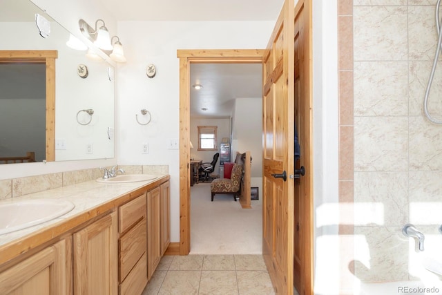 bathroom featuring tile patterned flooring and vanity