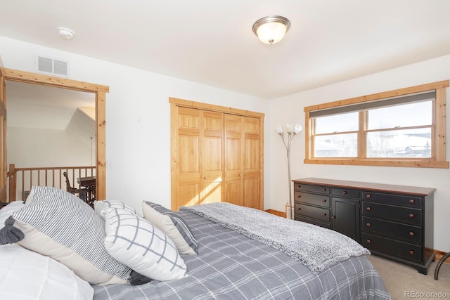 carpeted bedroom featuring a closet