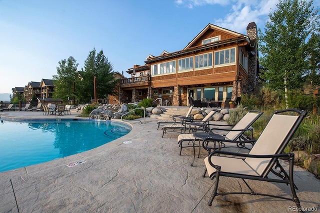 pool featuring a patio area