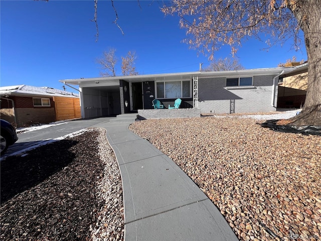 ranch-style home with a carport