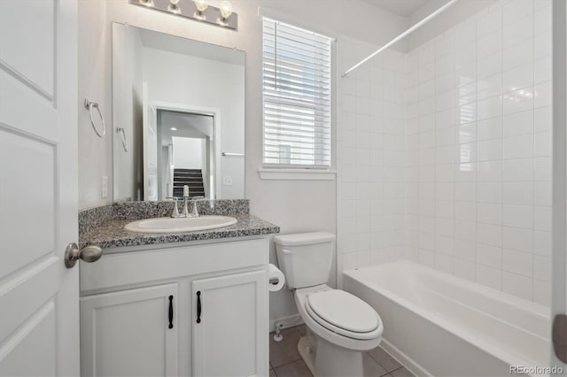 full bathroom featuring tile patterned floors, toilet, vanity, and shower / bath combination