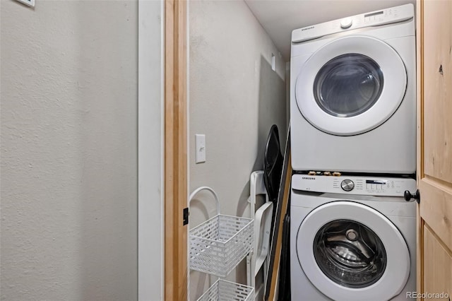 2449 Ryan Gulch Ct Unit 2449, Silverthorne, CO 80498 - washroom with estacked washer and dryer and a textured wall